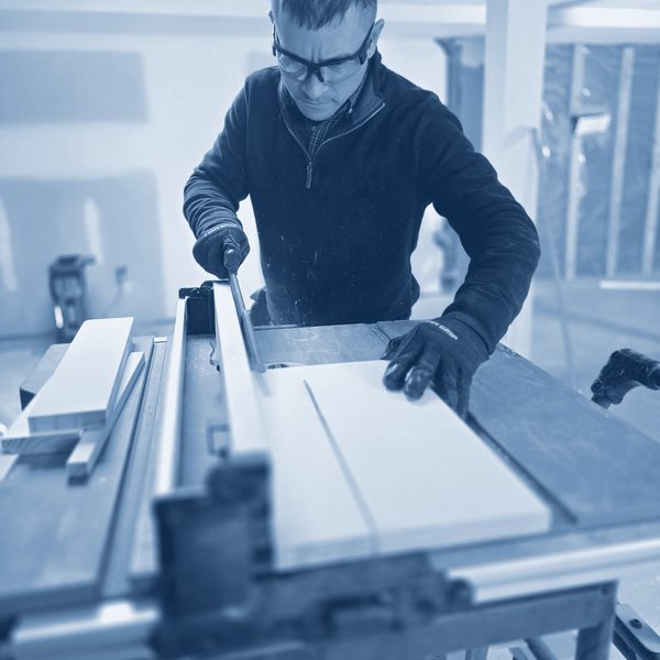 Charles cutting trim on a table saw